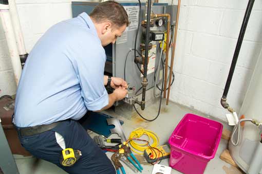 plumber-repairs-new-furnace New Furnace Repairs in Calgary