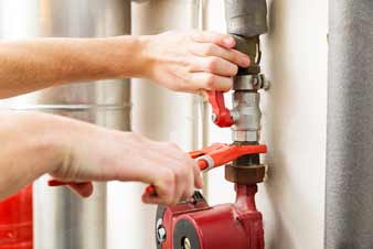 right-hand-wrench-man Red Wrench on Pipes